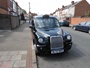 London Taxi Internation TX11, engine: Ford Transit 2.4 diesel, transmission: 4-speed  automatic gearbox, built: 2002. Converted (by Vision Motor Services Ltd) for film & tv work by addition of camera operators fold down seat in front, removable section of dividing partition & anchor points for camera tie downs or operator harness (c) 2014 Vision Motor Services Ltd