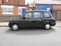 London Taxi Internation TX11, engine: Ford Transit 2.4 diesel, transmission: 4-speed  automatic gearbox, built: 2002. Converted (by Vision Motor Services Ltd) for film & tv work by addition of camera operators fold down seat in front, removable section of dividing partition & anchor points for camera tie downs or operator harness (c) 2014 Vision Motor Services Ltd