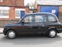 London Taxi Internation TX11, engine: Ford Transit 2.4 diesel, transmission: 4-speed  automatic gearbox, built: 2002. Converted (by Vision Motor Services Ltd) for film & tv work by addition of camera operators fold down seat in front, removable section of dividing partition & anchor points for camera tie downs or operator harness (c) 2014 Vision Motor Services Ltd