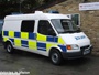 Ford Transit Mk6 combi van (part panel van, part minibus) used as local patrol vehicle with prisoner cage in rear, built 2000-2006 (c) 2013 Vision Motor Services Ltd